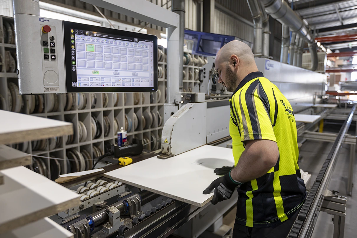 HOMAG S-500 edgebander applying fusion edge tape on cabinet panels
